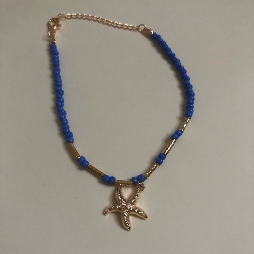 Costume bracelet with star charm. Never used.